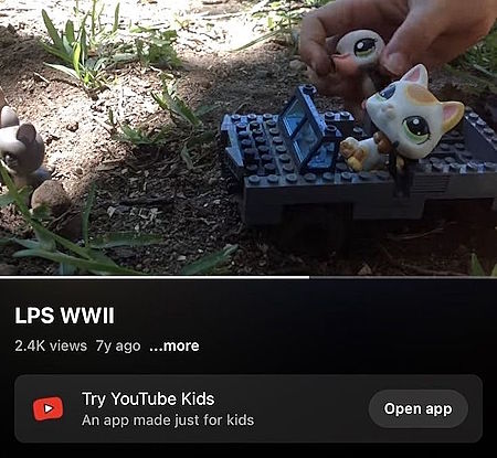 Screenshot from a YouTube video, in which someone is reenacting World War II using Little Pet Shop toys. A kitten and a pelican sit in a jeep made of Legos, driving through the dirt and grass in someone's backyard.

An ad at the bottom of the screen says Try YouTube Kids! An app made just for kids!